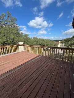a view of deck with wooden floor and city view