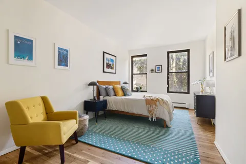 a bed room with bed and a couch