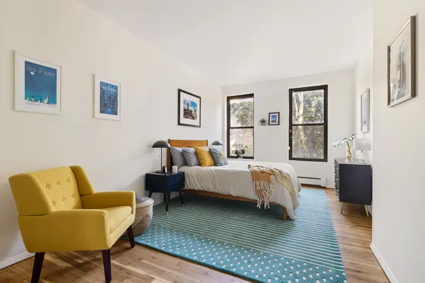 a bed room with bed and a couch