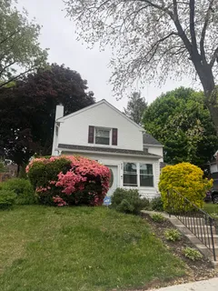 a front view of house with garden