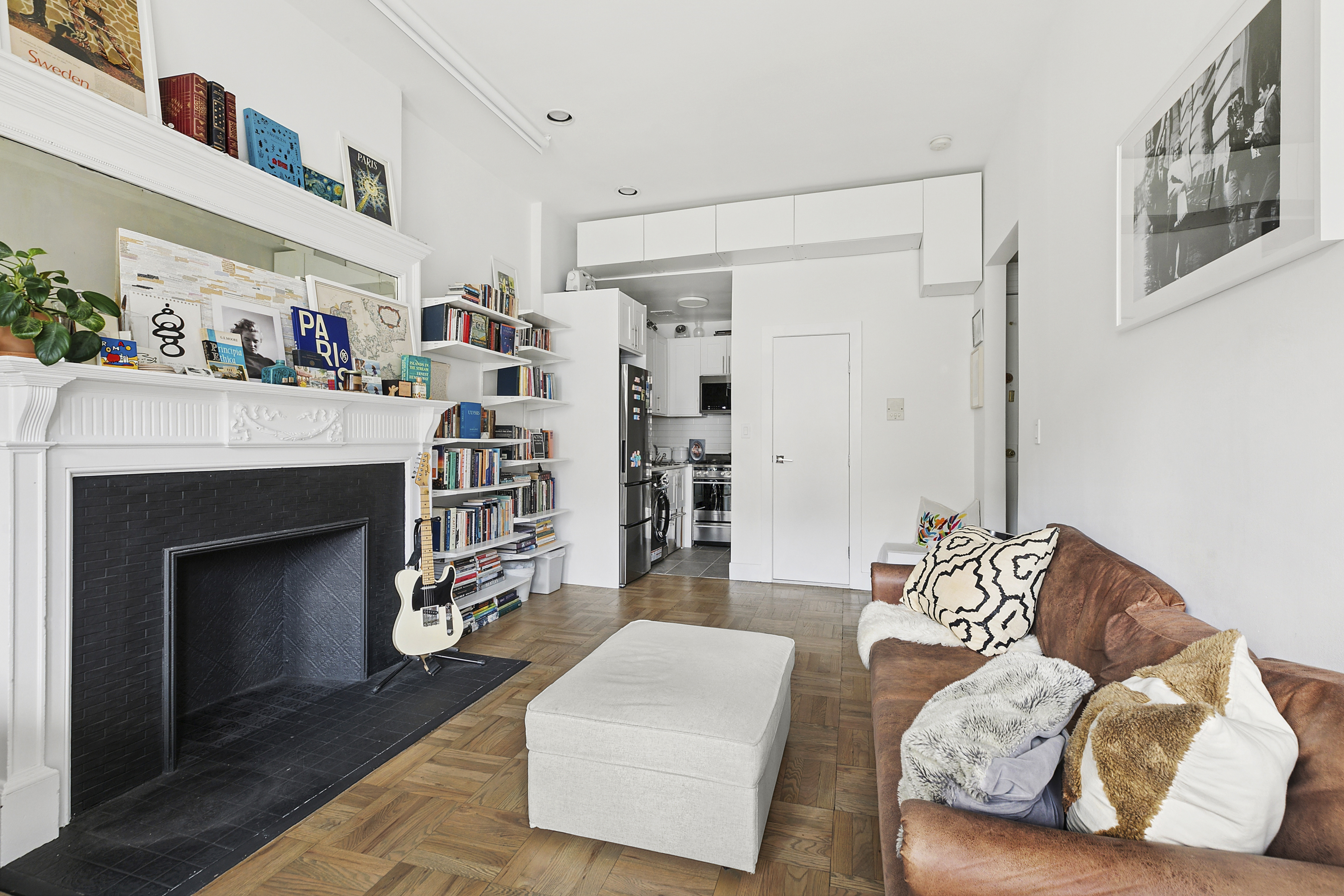 122 West 80th Street, Unit 3F Manhattan, NY 10024 - Photo 2 of 7 a living room with furniture and a fireplace