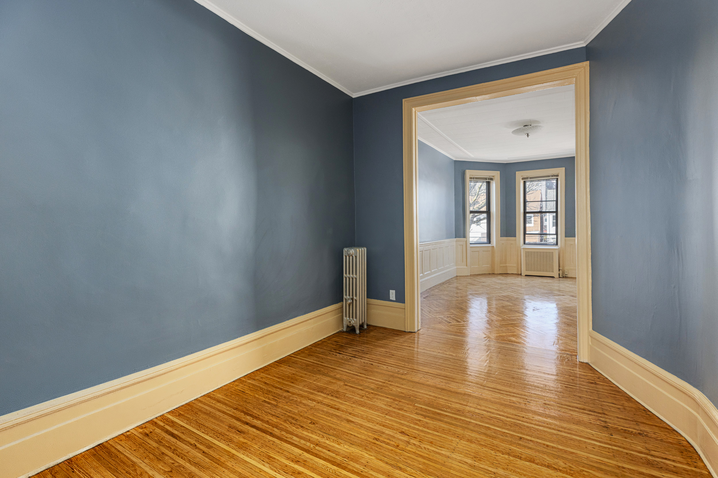 304 East 8th Street Brooklyn, NY 11218 - Photo 8 of 32 a view of a room with wooden floor and furniture