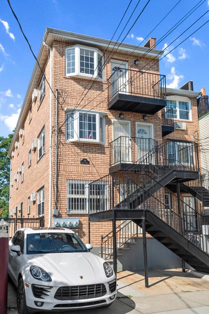 756 Barbey Street, Unit 1A Brooklyn, NY 11207 - Photo 8 of 9 a view of a brick building with many windows