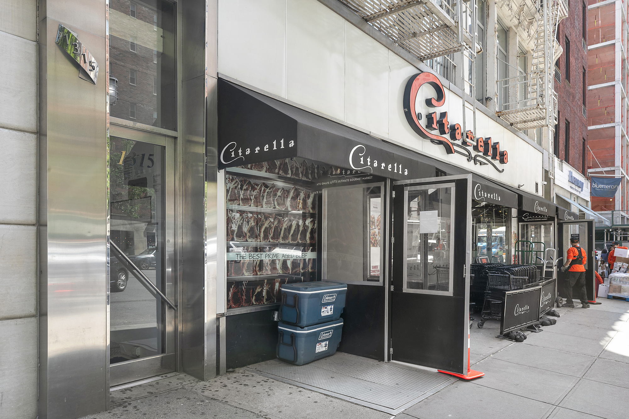 1315 3rd Avenue, Unit PH5RN Manhattan, NY 10021 - Photo 6 of 7 a view of a shop with a street sign and a store