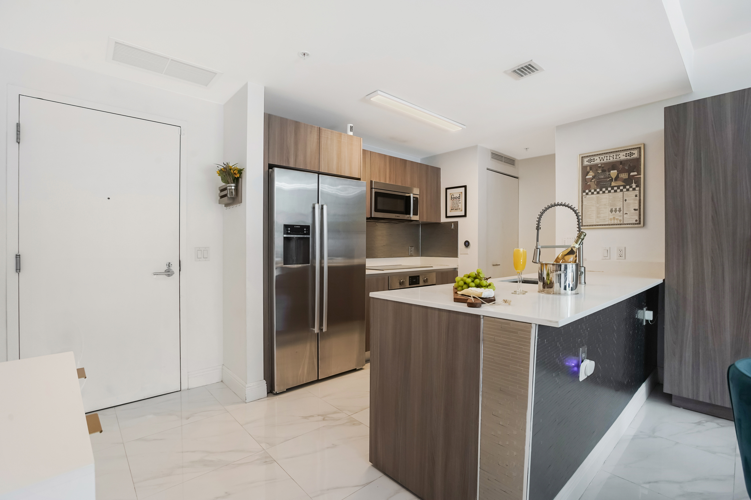 201 Southwest 17th Road, Unit 311 Miami, FL 33129 - Photo 7 of 21 a kitchen with stainless steel appliances a sink stove and refrigerator