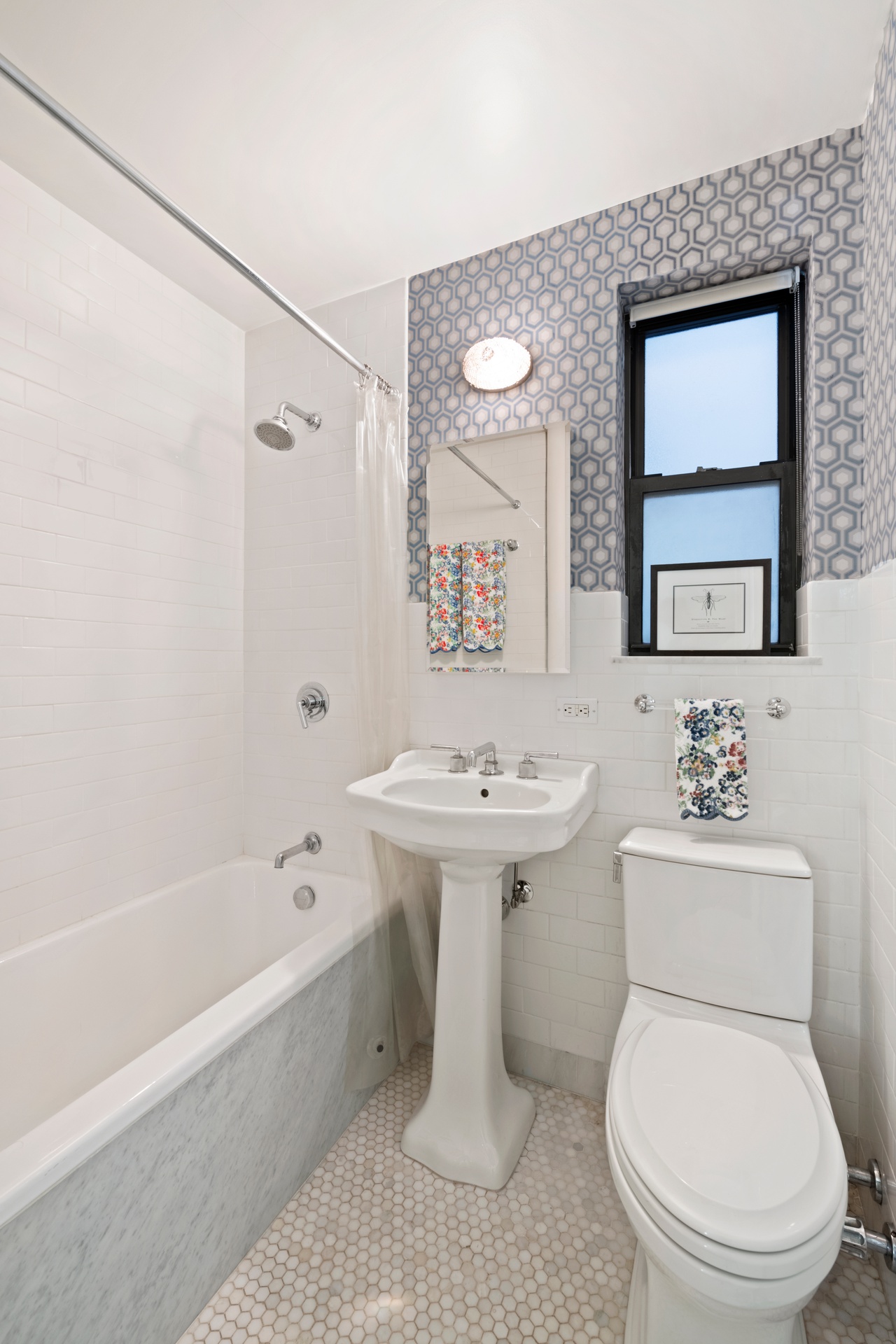 225 East 79th Street, Unit 3A Manhattan, NY 10075 - Photo 9 of 10 a bathroom with a sink toilet and shower
