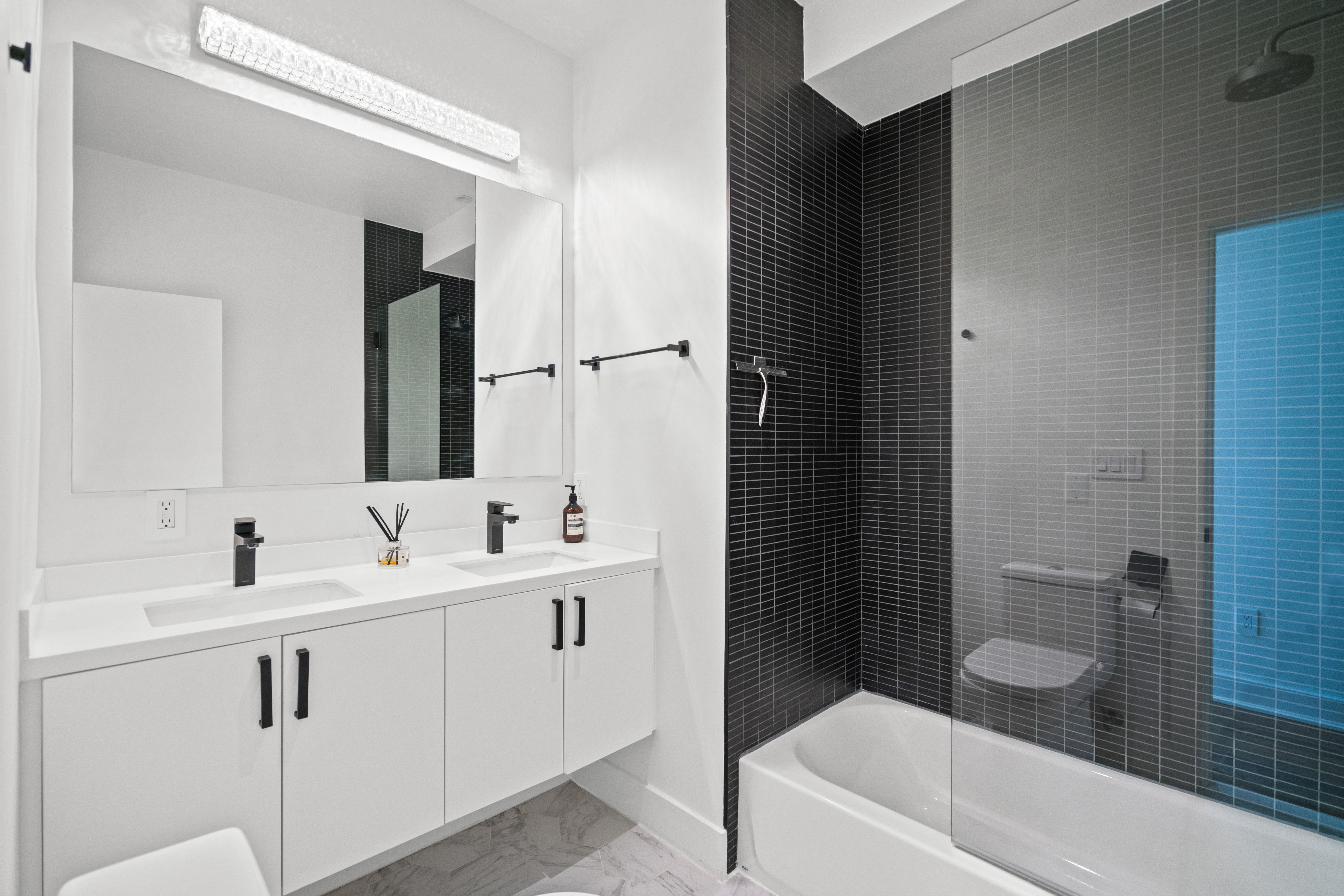 445 Ridge Street Northwest Washington, DC 20001 - Photo 22 of 43 a bathroom with a sink a toilet and shower