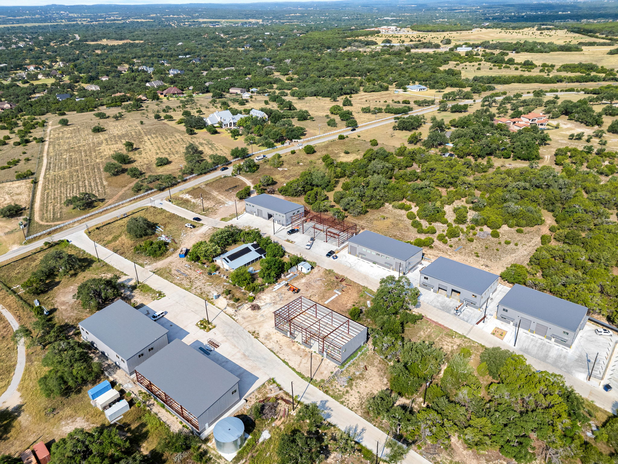 10020 Darden Hill Road, Unit 401 Austin, TX 78737 - Photo 47 of 50 an aerial view of residential houses with outdoor space