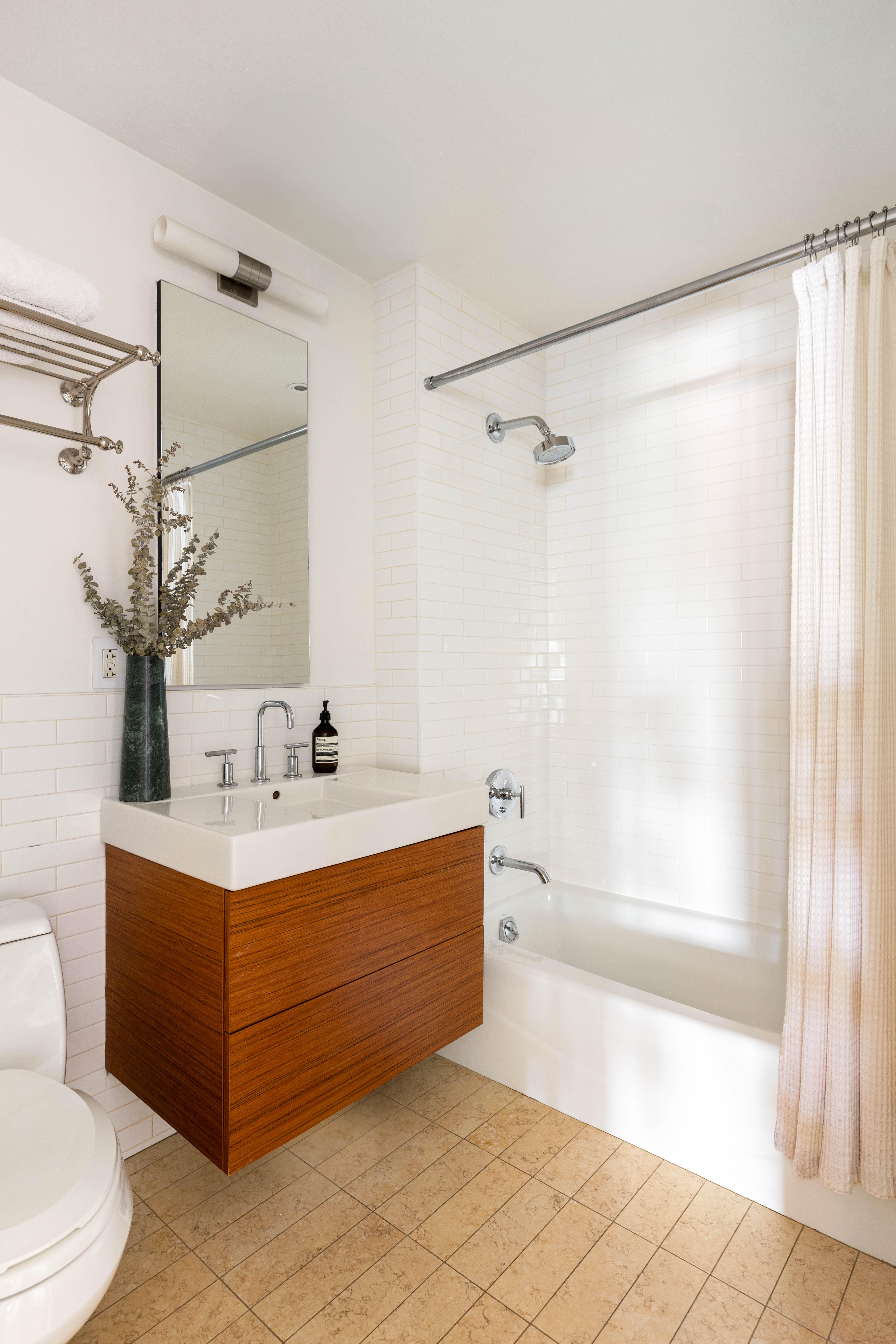 20 Henry Street, Unit 5D/S Brooklyn, NY 11201 - Photo 14 of 15 a bathroom with a tub sink and mirror