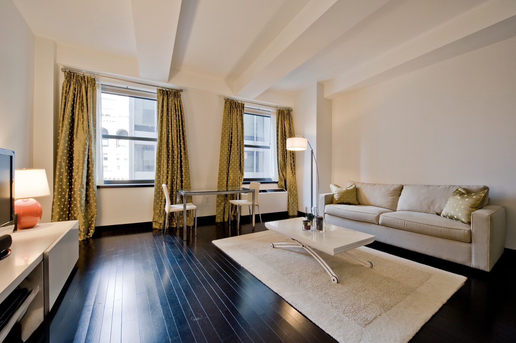 20 Pine Street, Unit 1415 Manhattan, NY 10005 - Photo 1 of 8 a living room with furniture and wooden floor
