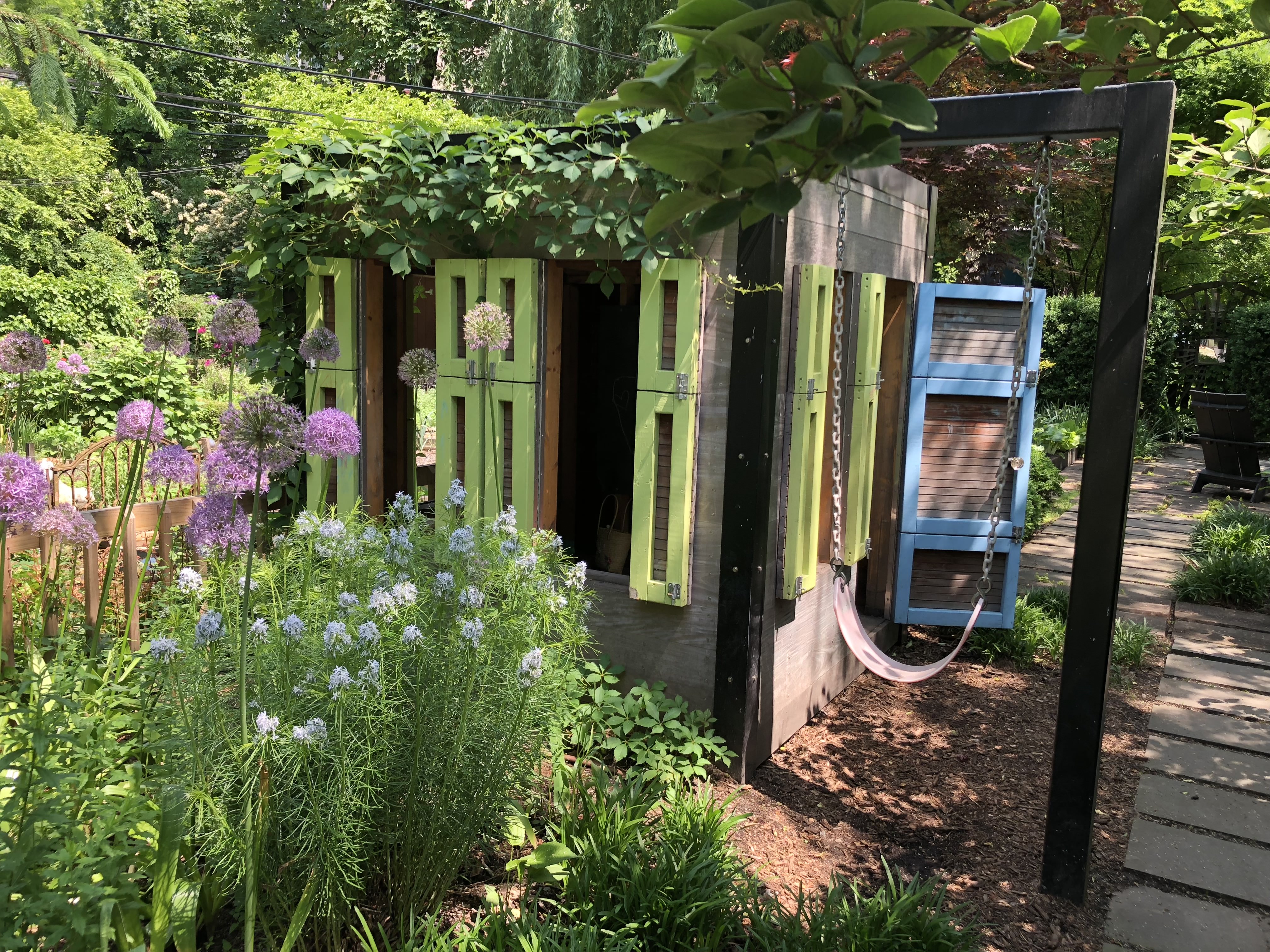 171 Garfield Place Brooklyn, NY 11215 - Photo 16 of 19 a backyard of a house with lots of green space and glass windows