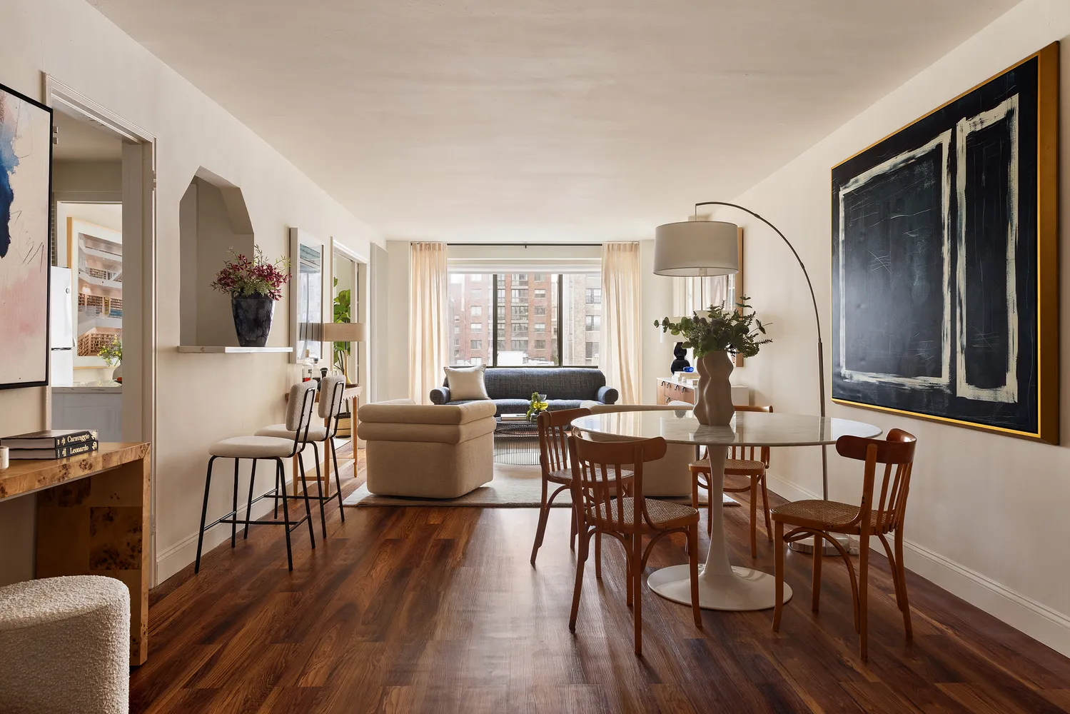 a view of a dining room with furniture window and wooden floor