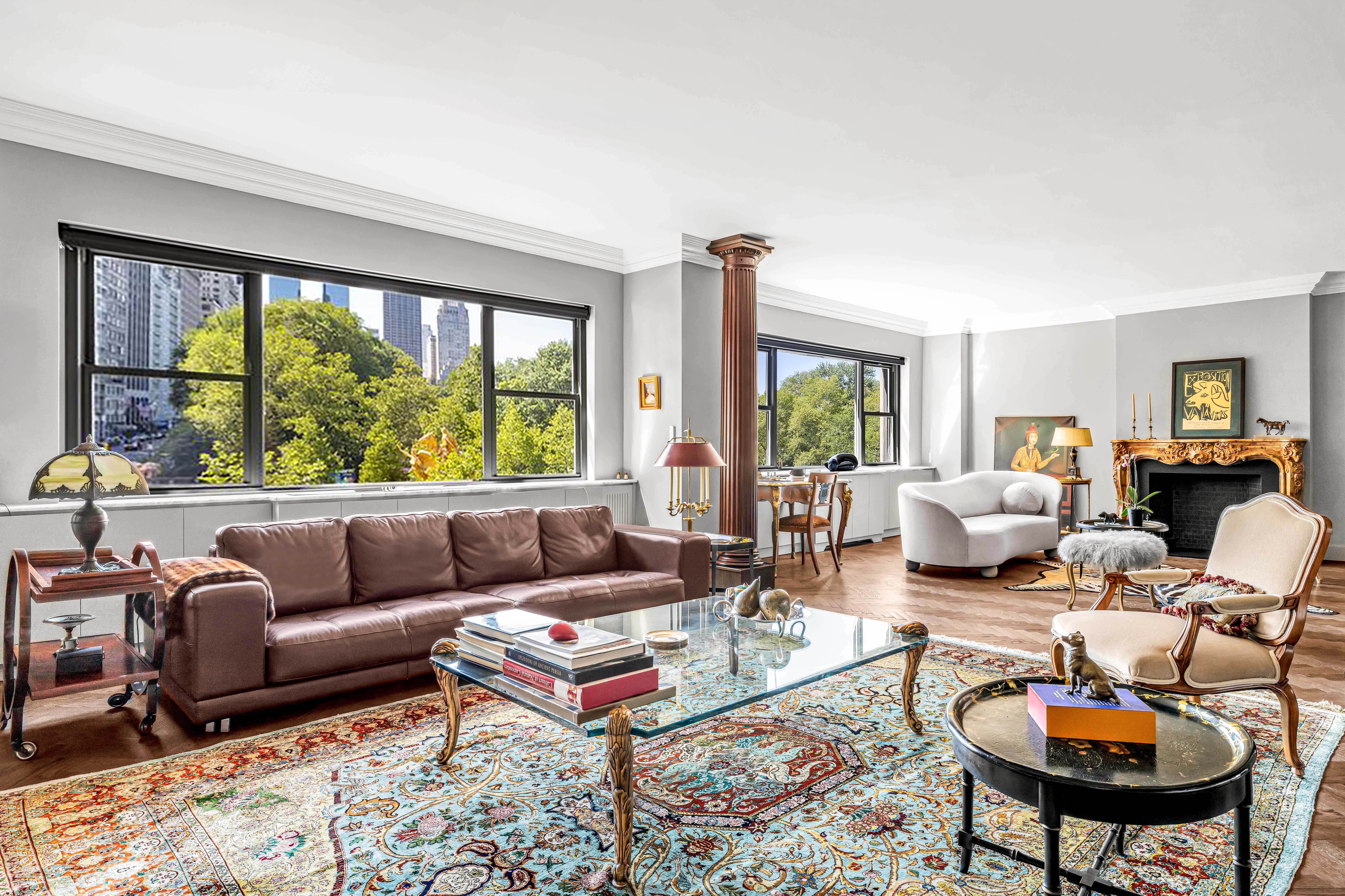 785 5th Avenue, Unit 3C Manhattan, NY 10022 - Photo 1 of 16 a living room with furniture and a large window