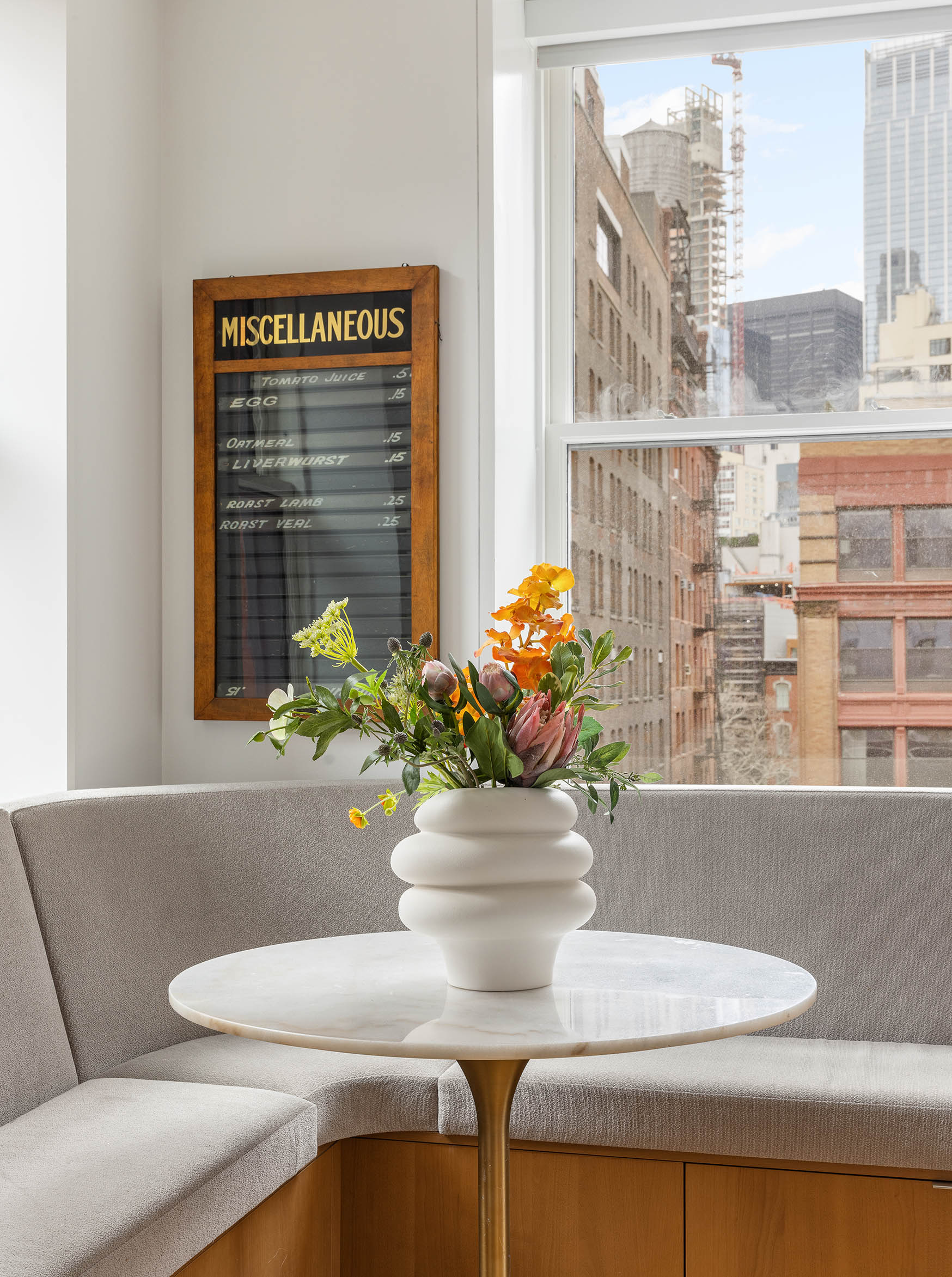 7 Harrison Street, Unit 5S Manhattan, NY 10013 - Photo 11 of 21 a dining room with furniture and flowers