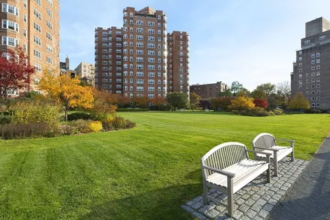 a view of a swimming pool with a yard
