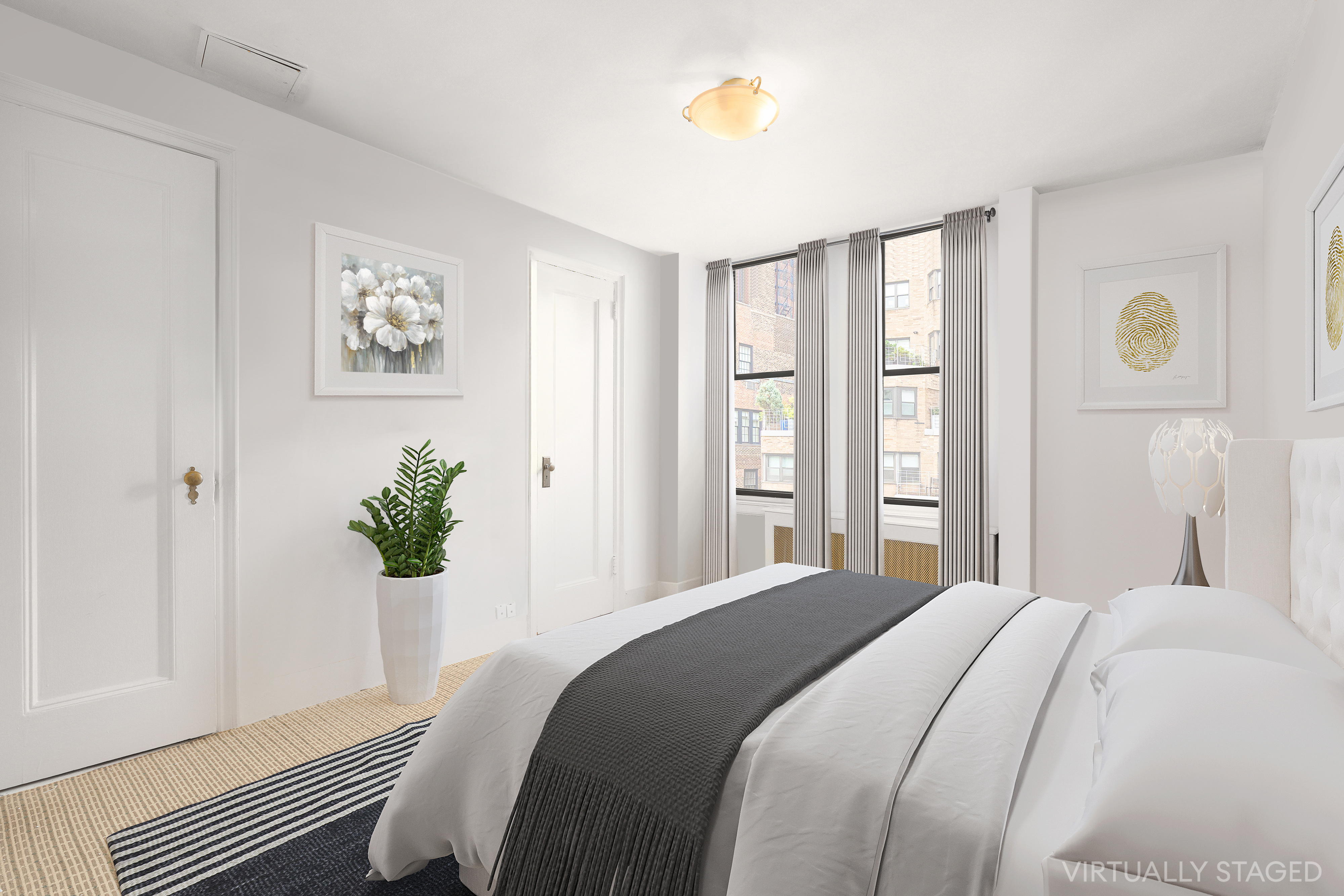 140 East 81st Street, Unit 12B Manhattan, NY 10028 - Photo 7 of 9 a bedroom with a bed and a window