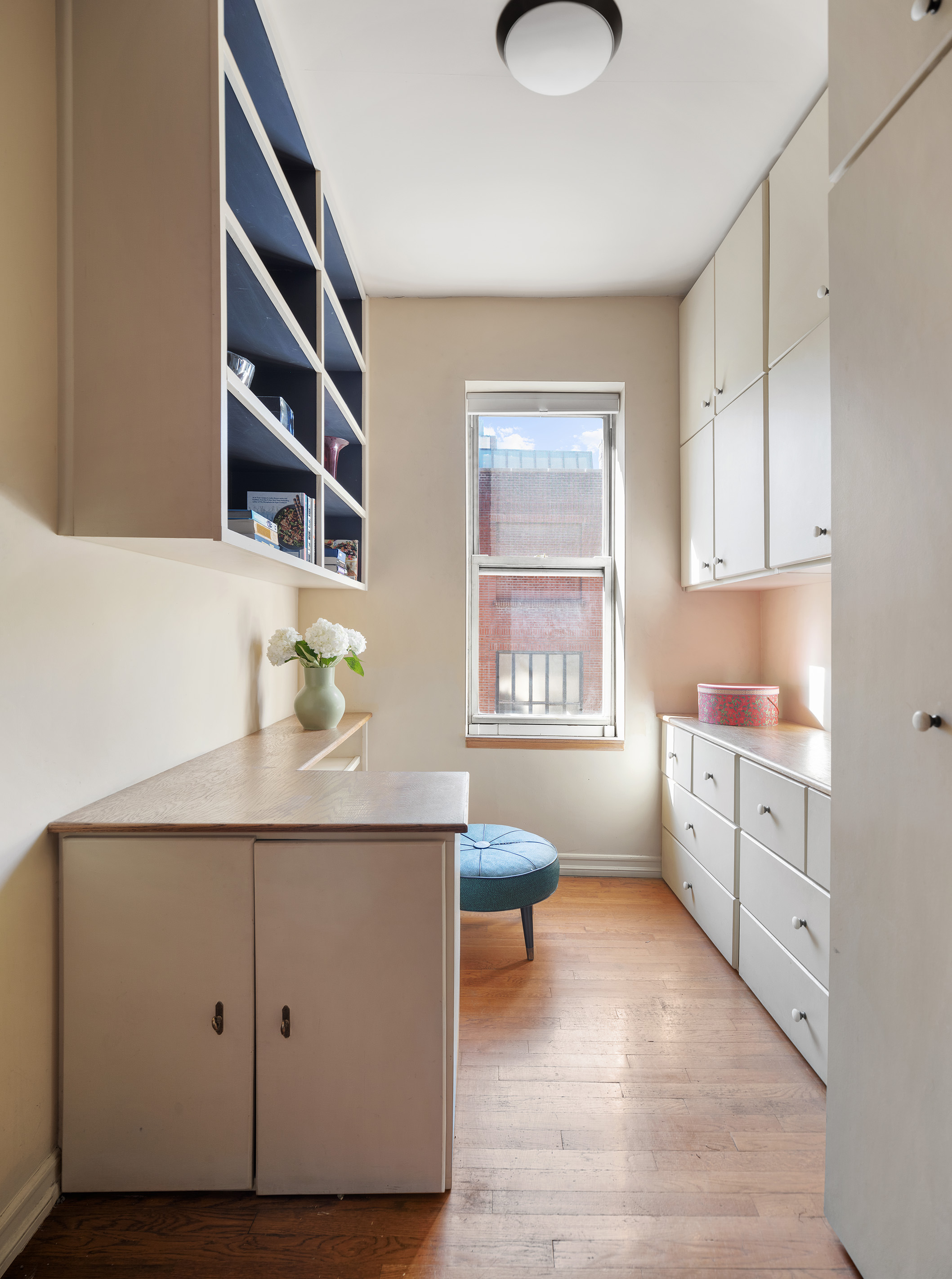 25 Charles Street, Unit 3B Manhattan, NY 10014 - Photo 5 of 9 a kitchen with cabinets and window