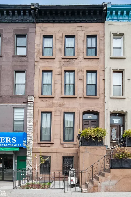 a red brick building that has lot of windows on it