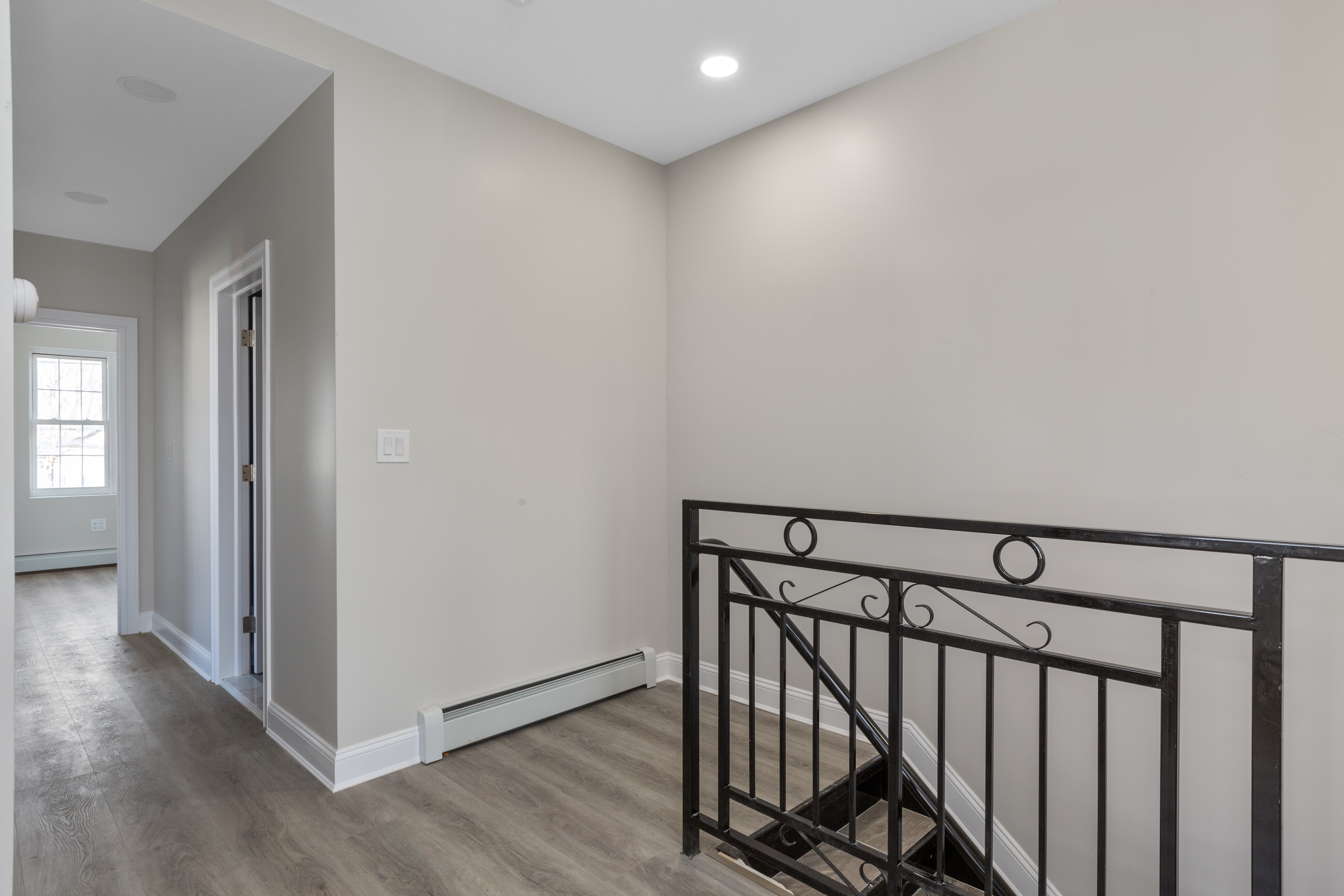 143-10 Shore Avenue Queens, NY 11435 - Photo 6 of 30 a view of a hallway with wooden floor