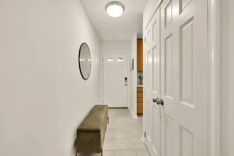 a bathroom with a granite countertop shower and a mirror