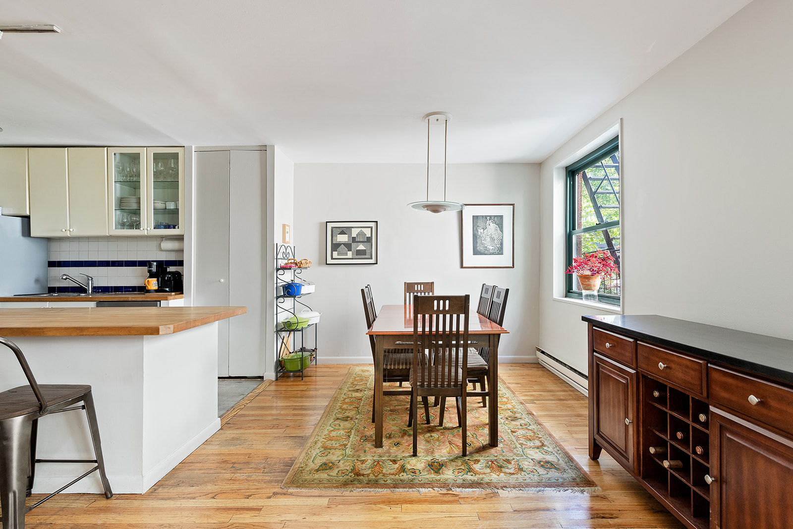 153 Perry Street, Unit 4B Manhattan, NY 10014 - Photo 3 of 10 a living room with furniture and a wooden floor
