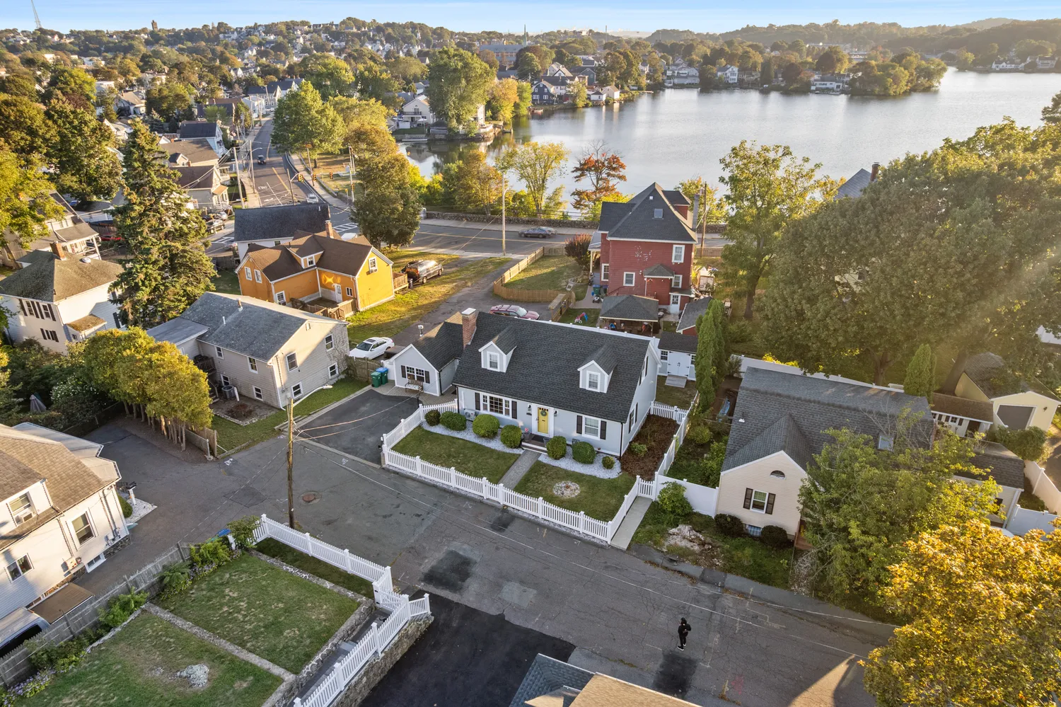 an aerial view of a house with a lake view