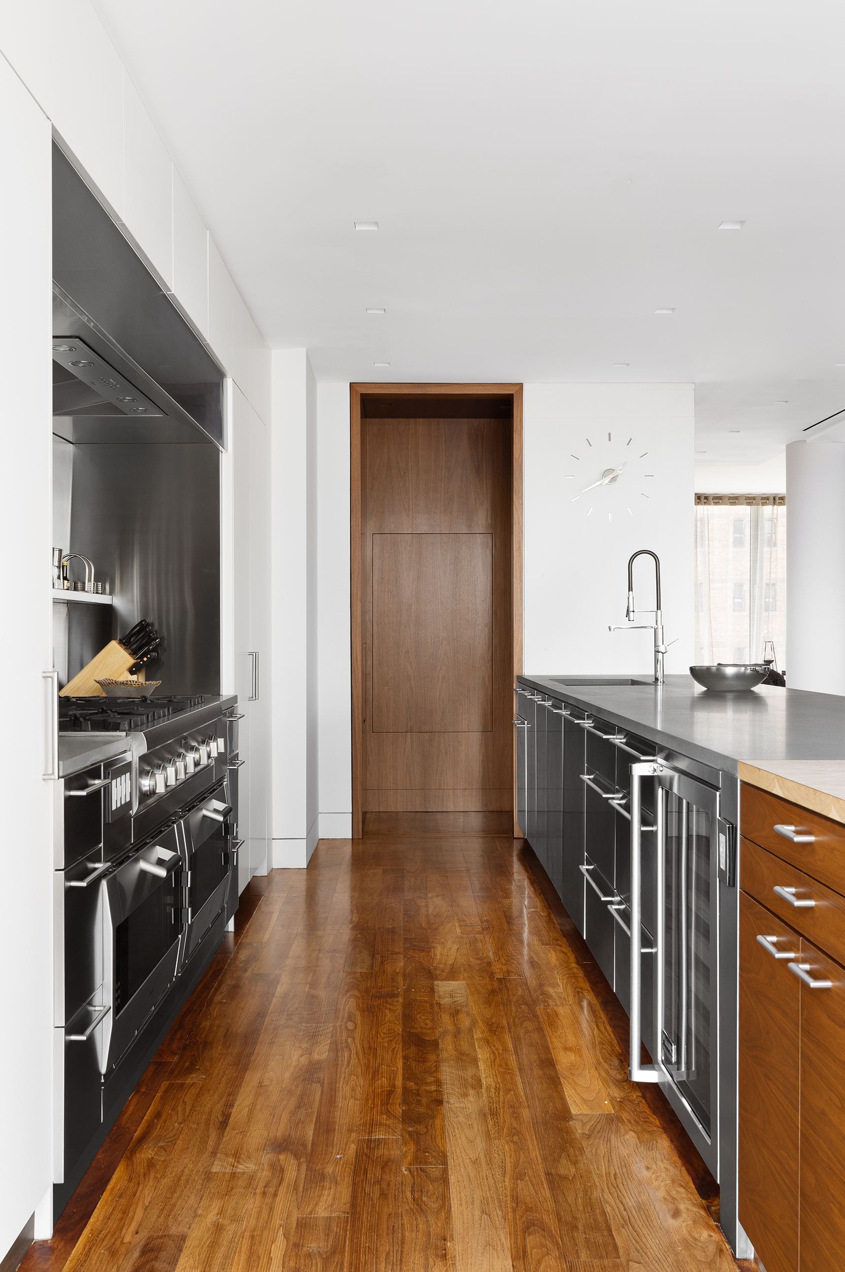 57 Irving Place, Unit PH9/10 Manhattan, NY 10003 - Photo 8 of 33 a kitchen with stainless steel appliances granite countertop a stove a sink and a refrigerator