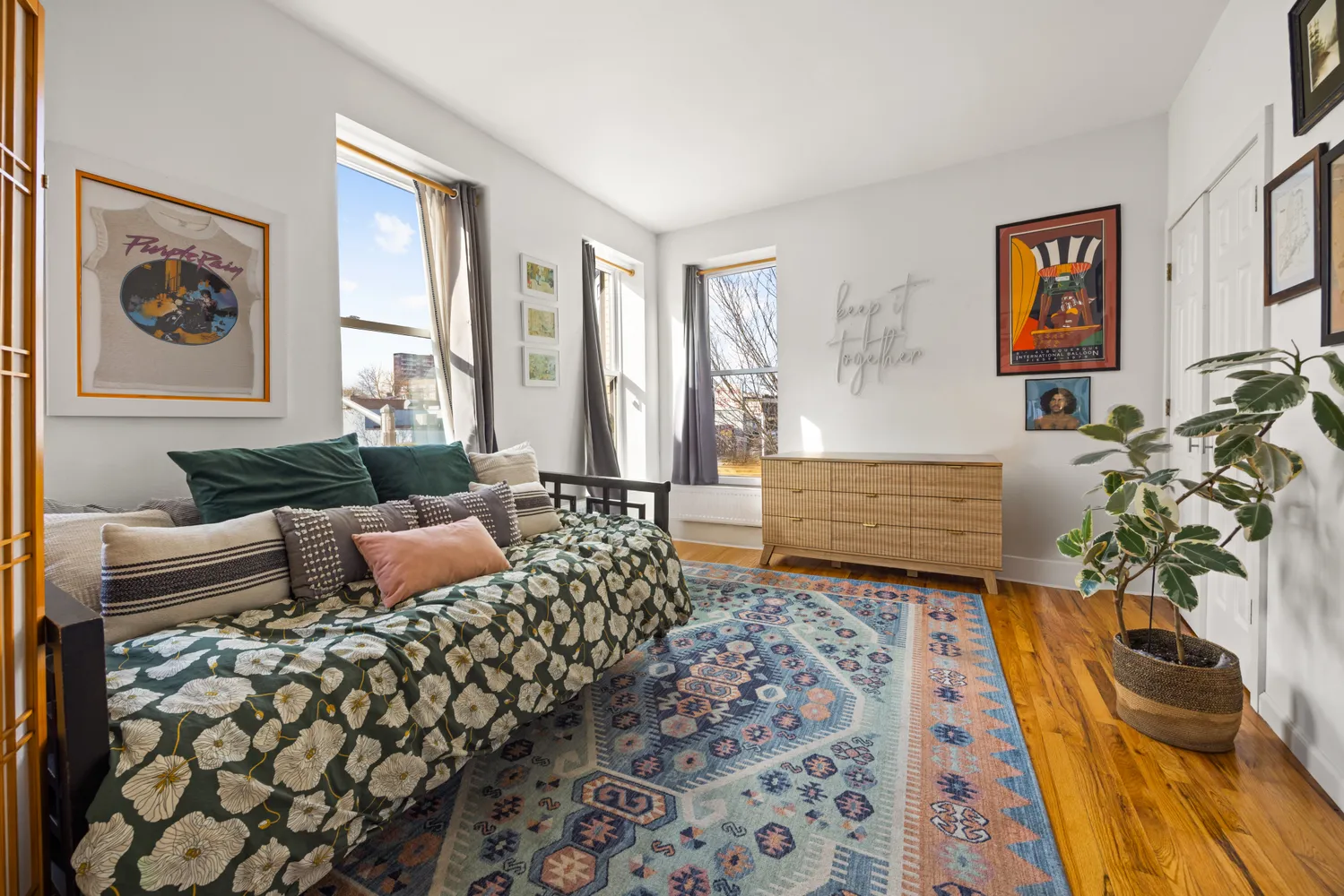 a bedroom with furniture and a rug
