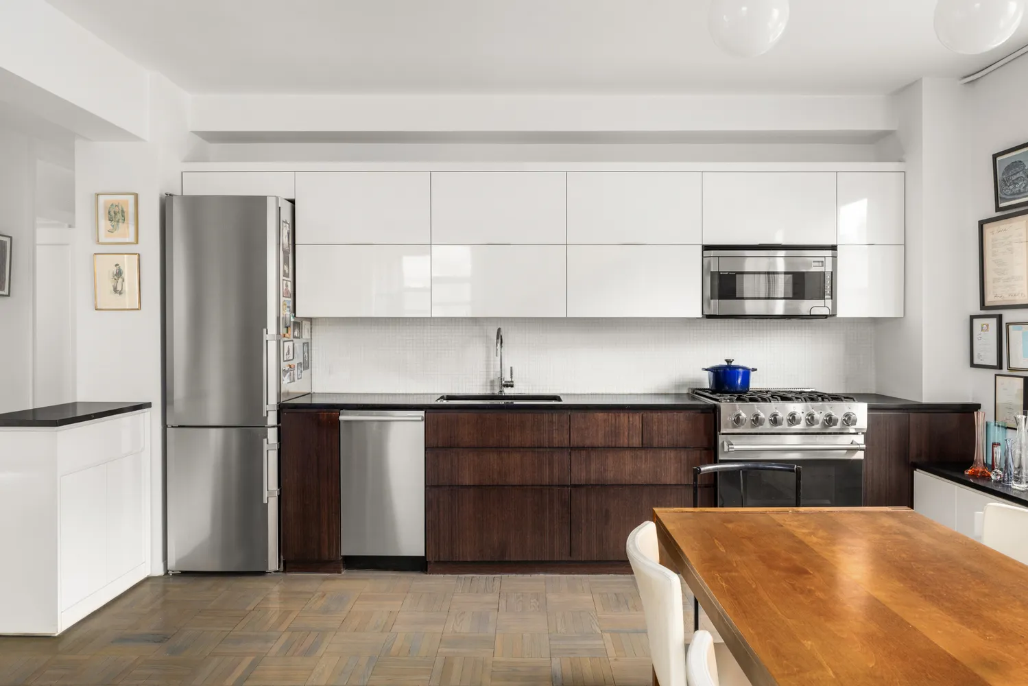 a kitchen with stainless steel appliances granite countertop a refrigerator and a stove top oven