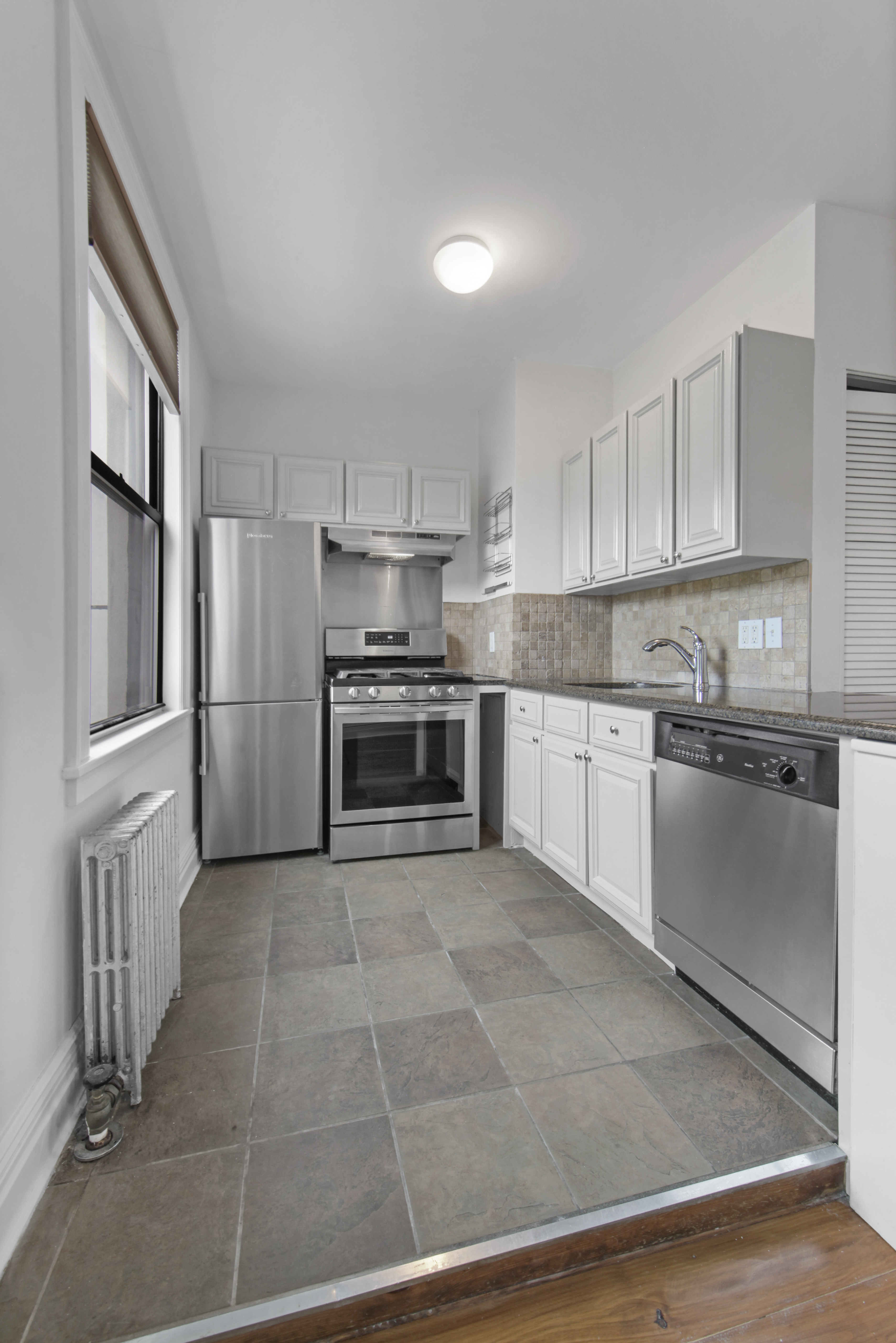 43 Douglass Street, Unit 3 Brooklyn, NY 11231 - Photo 2 of 12 a kitchen with stainless steel appliances granite countertop a refrigerator oven a sink and dishwasher