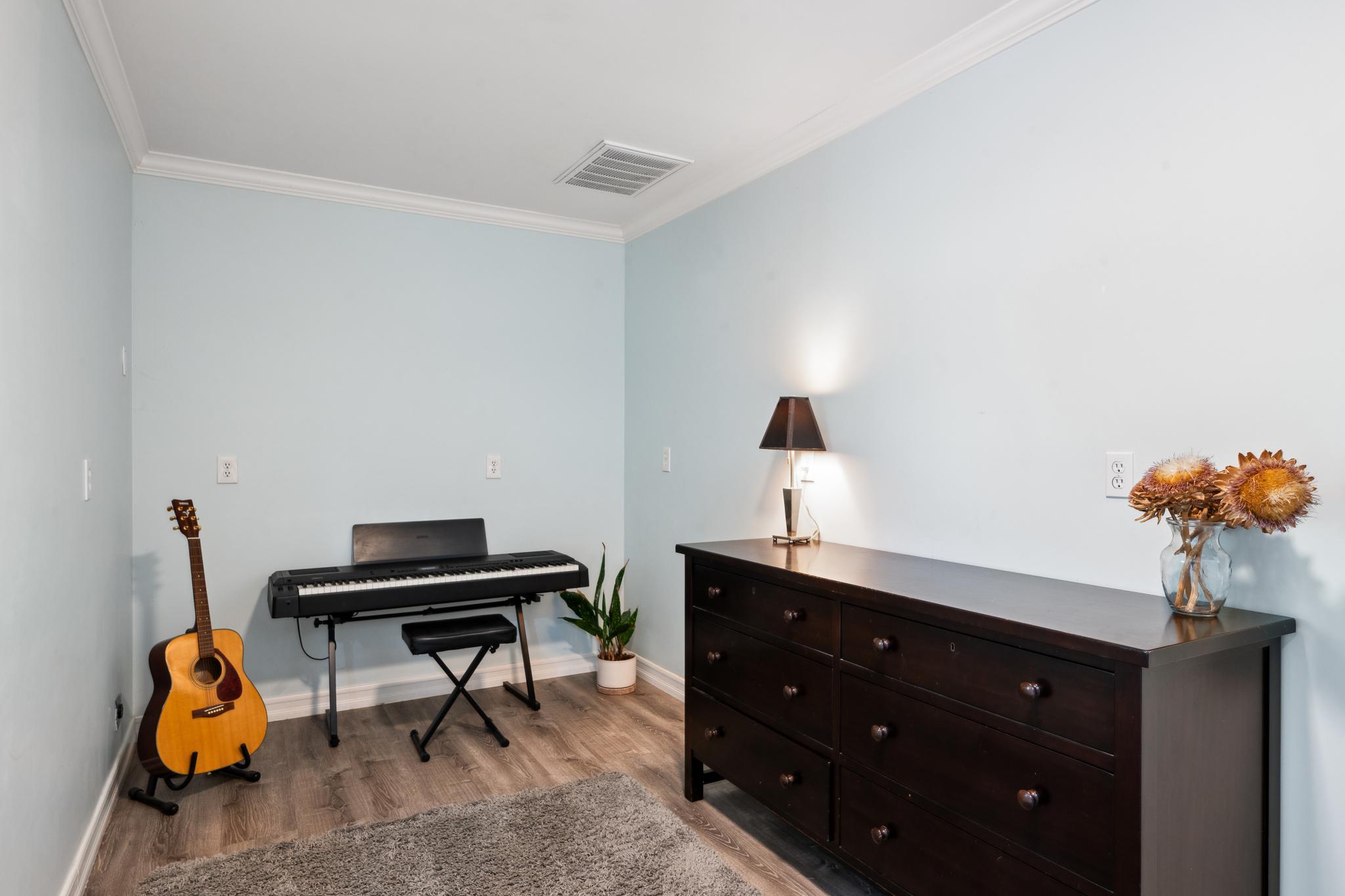 123 Frey Road Santa Rosa, CA 95409 - Photo 43 of 62 a bedroom with a bed and a chandelier