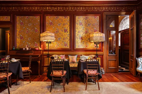 a view of a chairs and table in a room