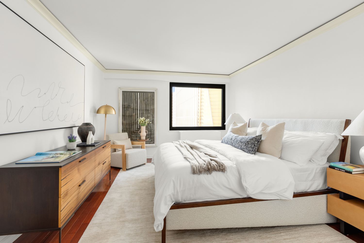 a bedroom with a bed and dresser