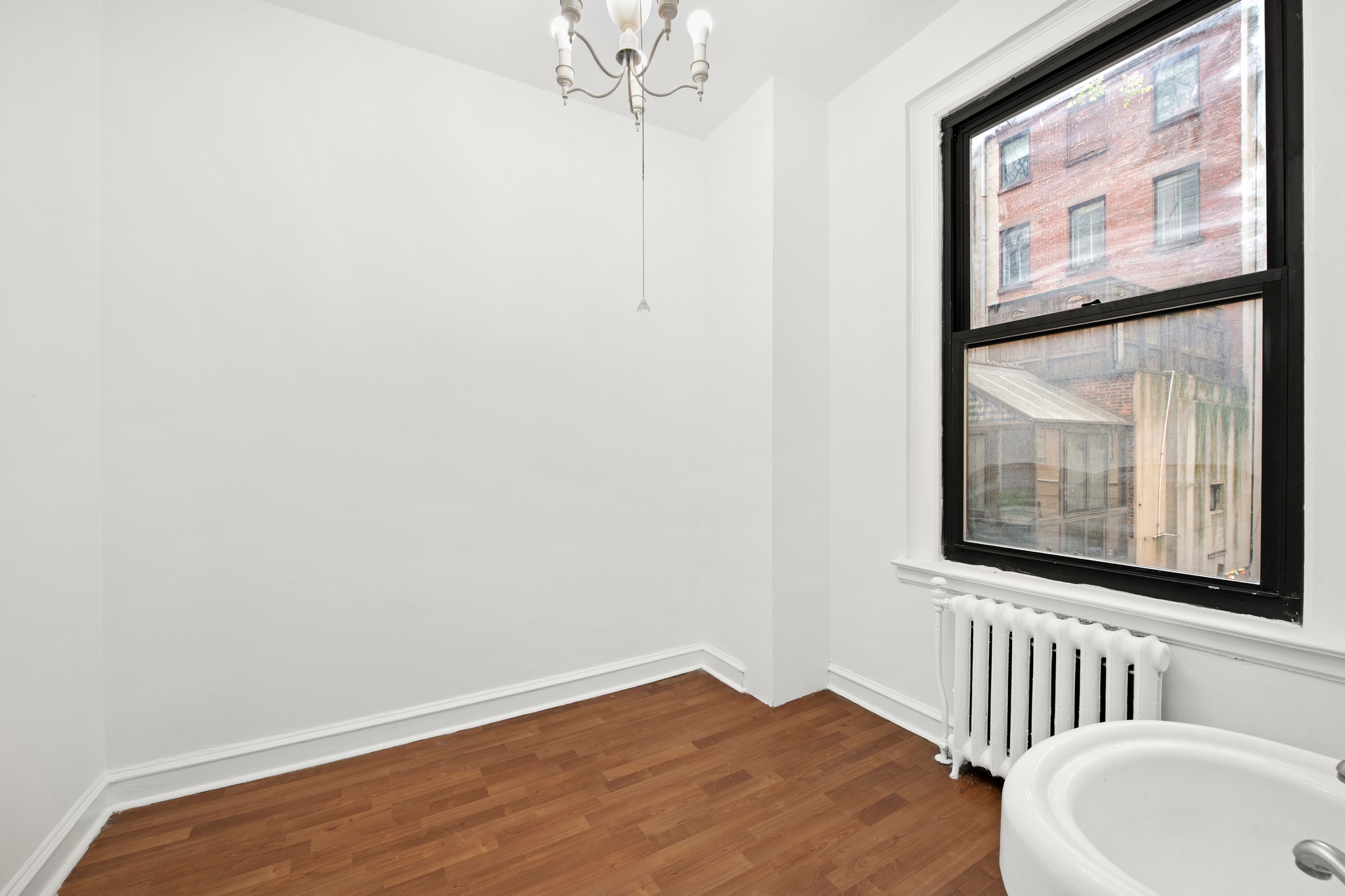 55 East 72nd Street, Unit 2NORTH Manhattan, NY 10021 - Photo 15 of 18 a bathroom with a sink and a window