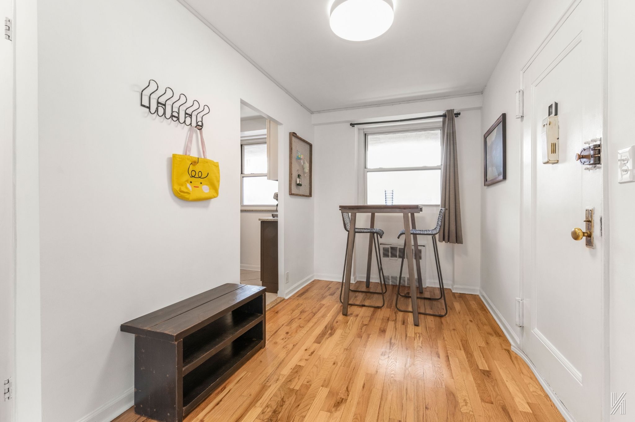 35-50 85th Street, Unit 7H Queens, NY 11372 - Photo 7 of 16 a view of a kitchen with wooden floor