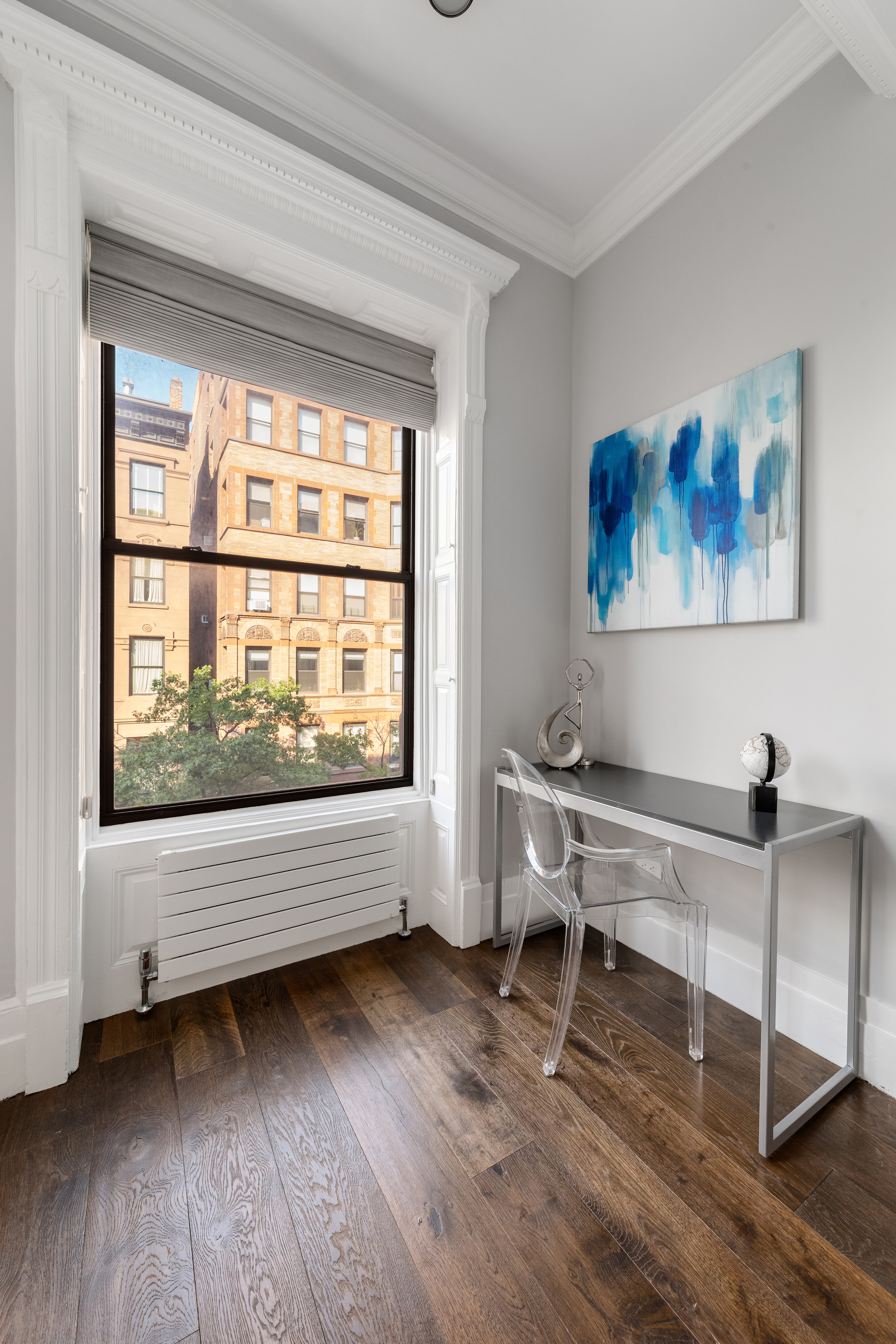 110 West 81st Street Manhattan, NY 10024 - Photo 21 of 30 a view of a workspace with furniture window and wooden floor