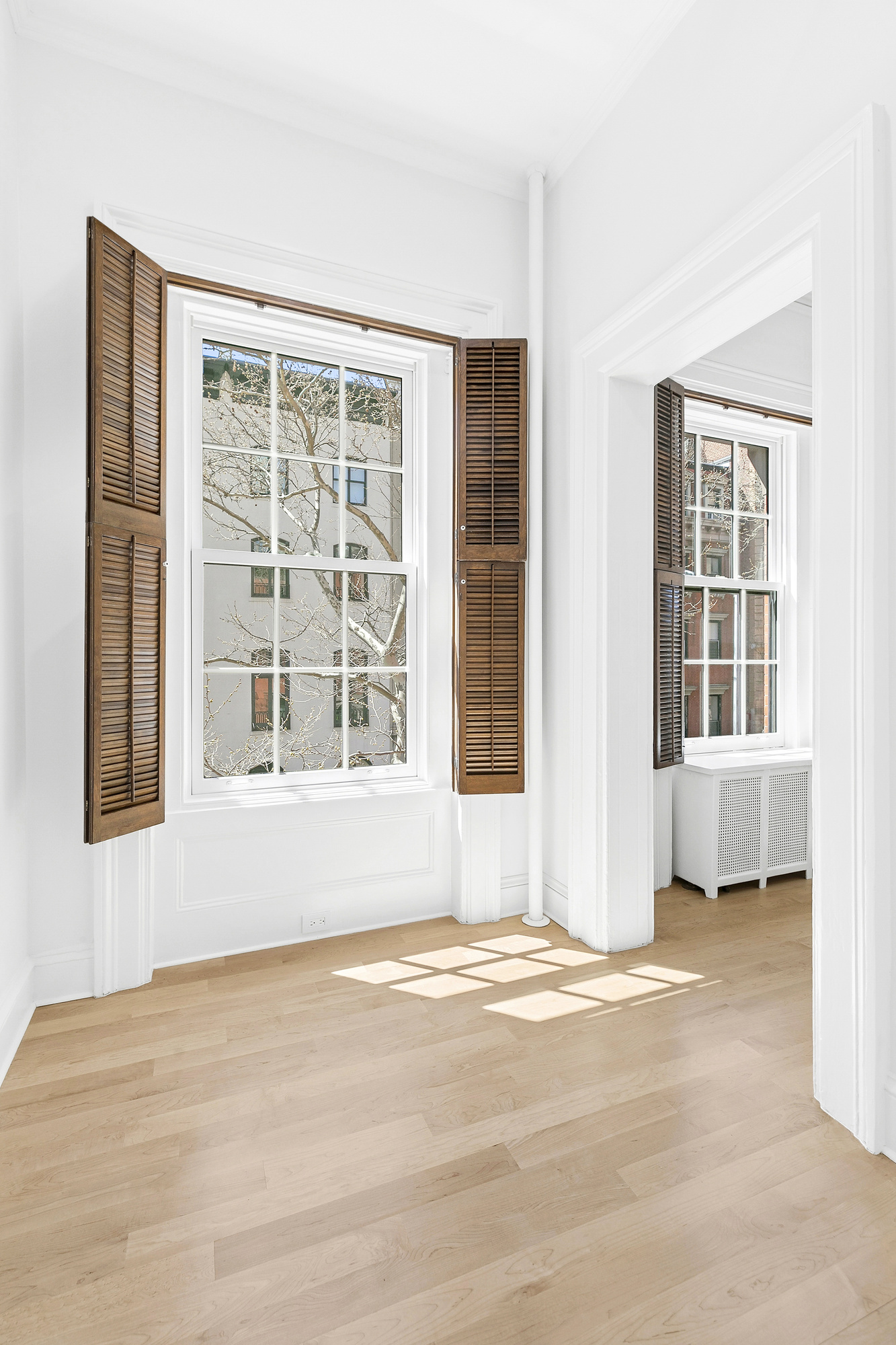 221 East 17th Street, Unit 2 Manhattan, NY 10003 - Photo 6 of 9 a view of an empty room with a window