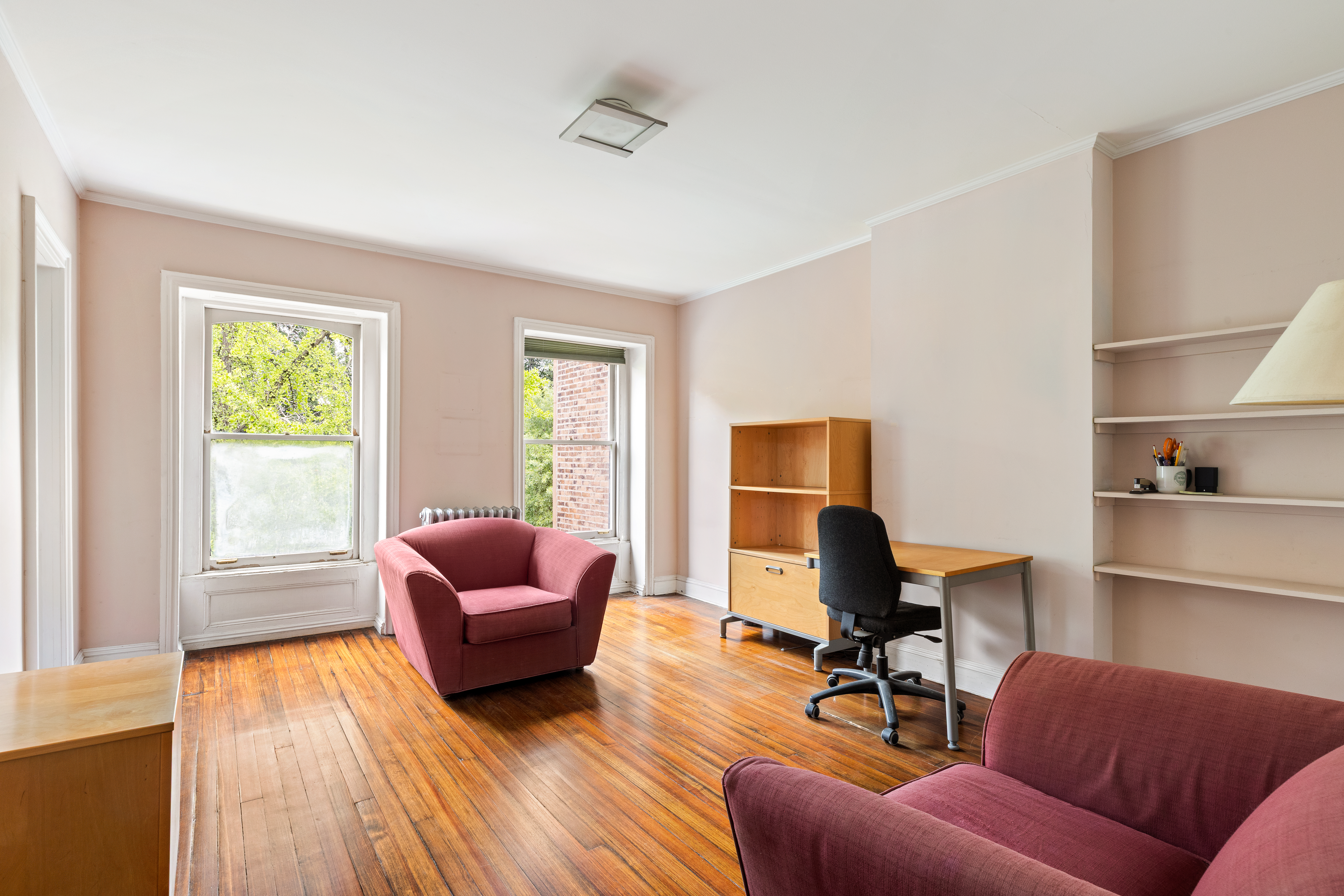 152 Dekalb Avenue Brooklyn, NY 11217 - Photo 18 of 27 a living room with furniture and a wooden floor