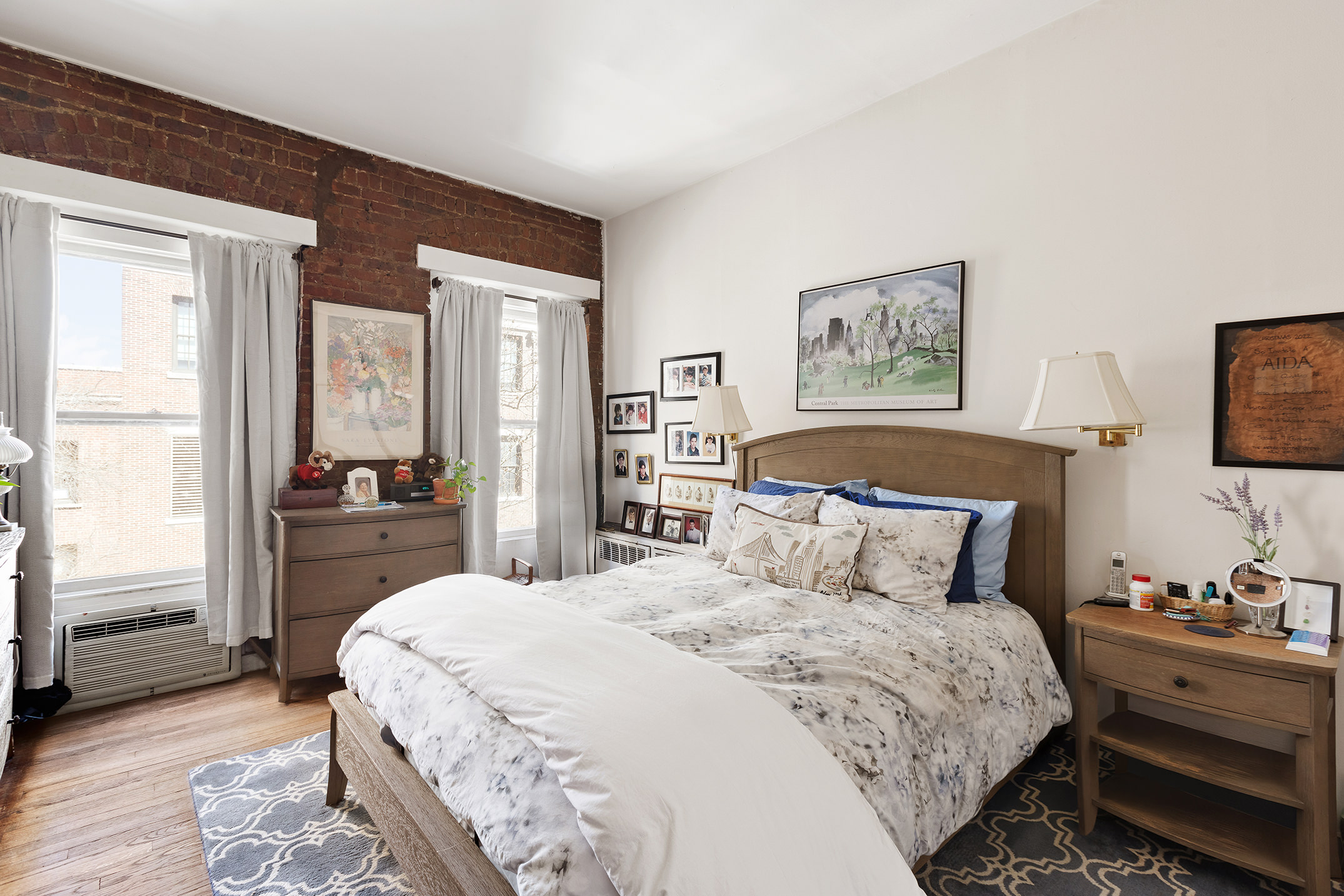 138 West 73rd Street Manhattan, NY 10023 - Photo 26 of 35 a bedroom with a large bed and a chandelier