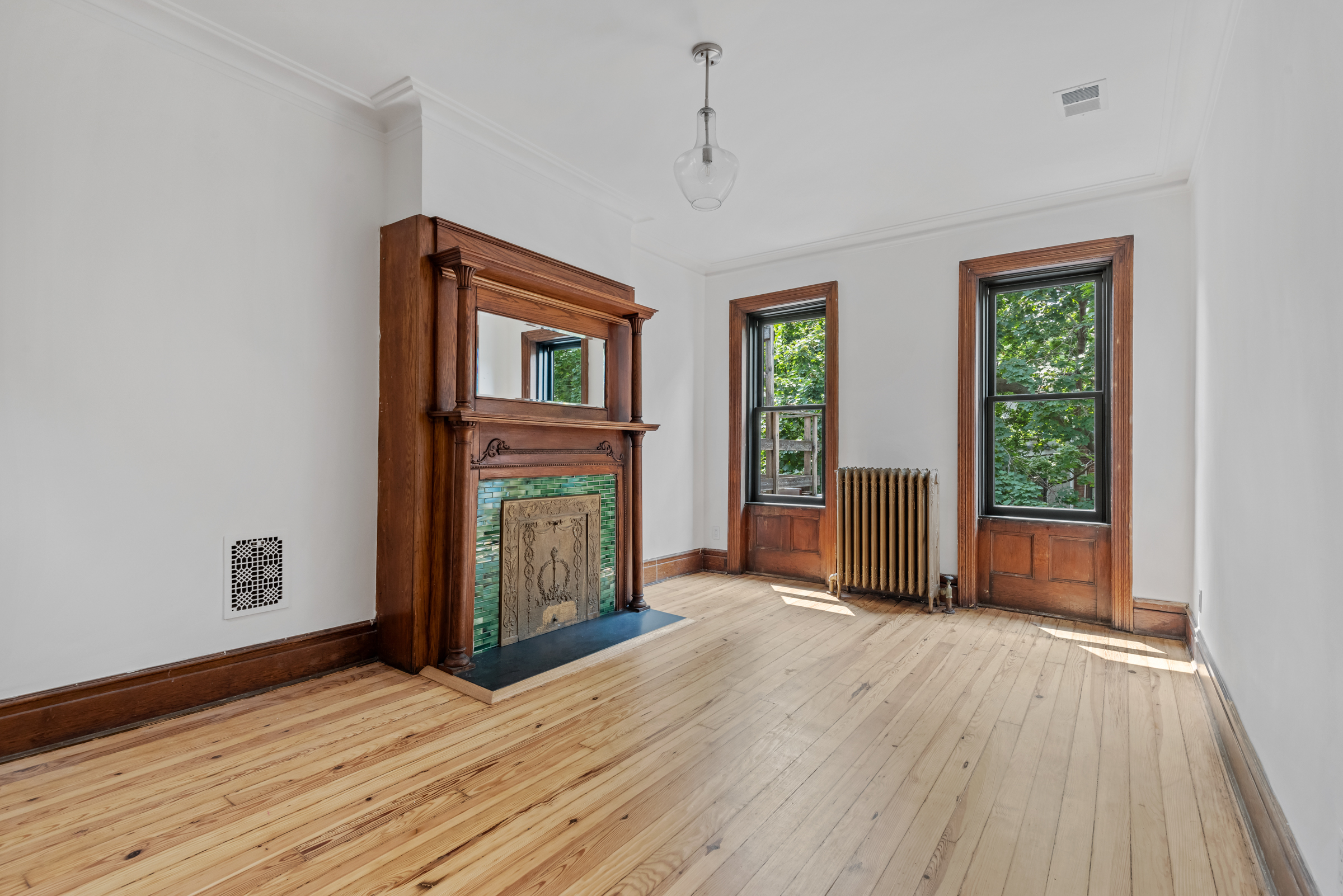 616 2nd Street Brooklyn, NY 11215 - Photo 15 of 19 a view of an empty room with wooden floor and a window