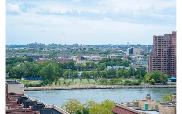 a view of a lake with a city