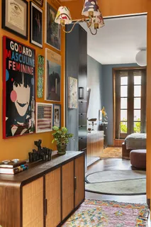 a lobby with furniture and chandelier