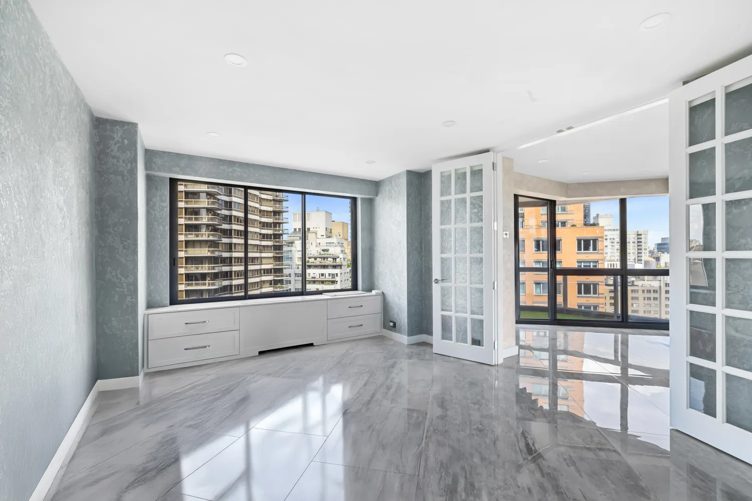 a view of an empty room with a window