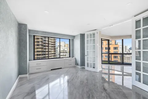 a view of an empty room with a window