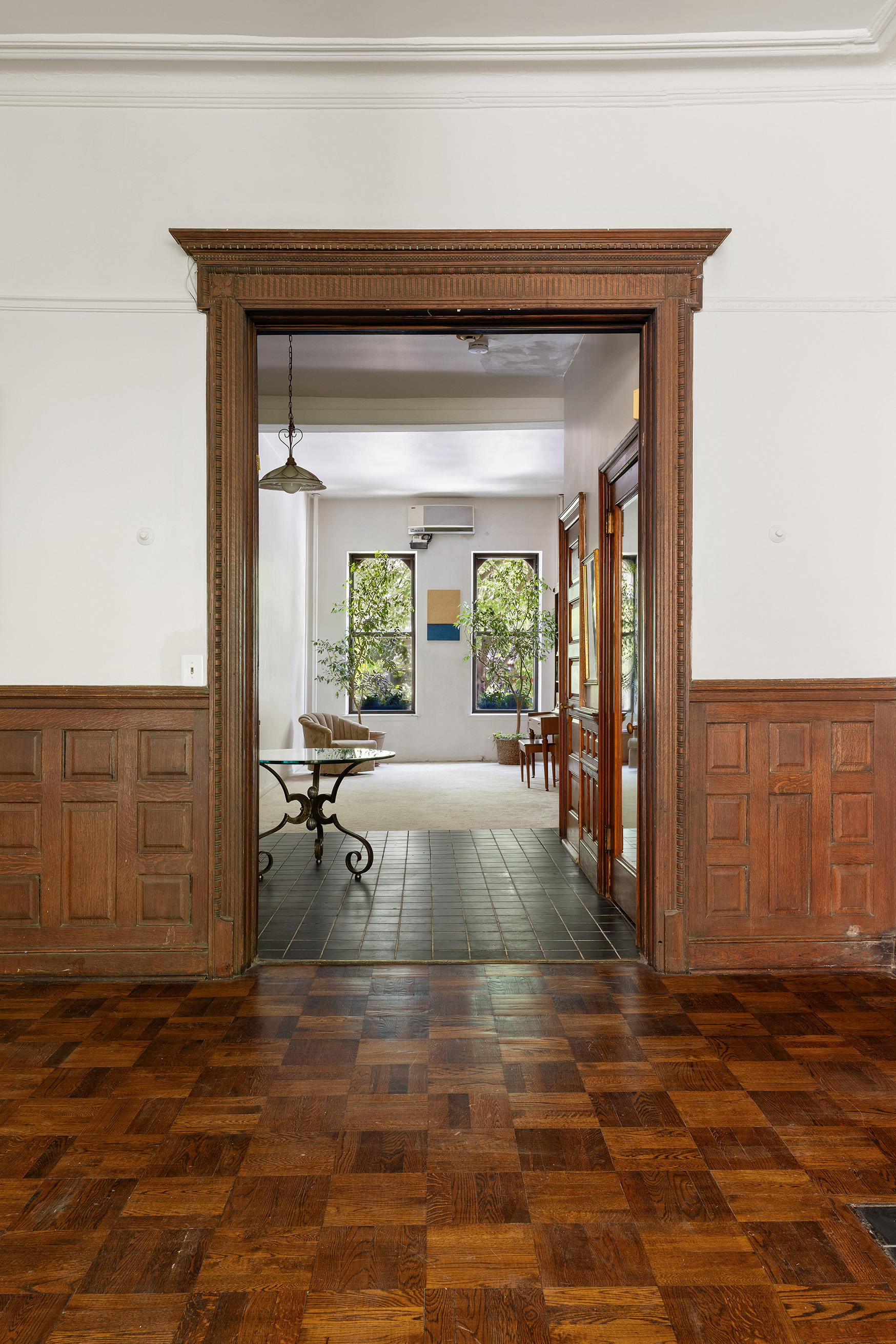 144 West 80th Street Manhattan, NY 10024 - Photo 9 of 22 a living room with furniture and large windows