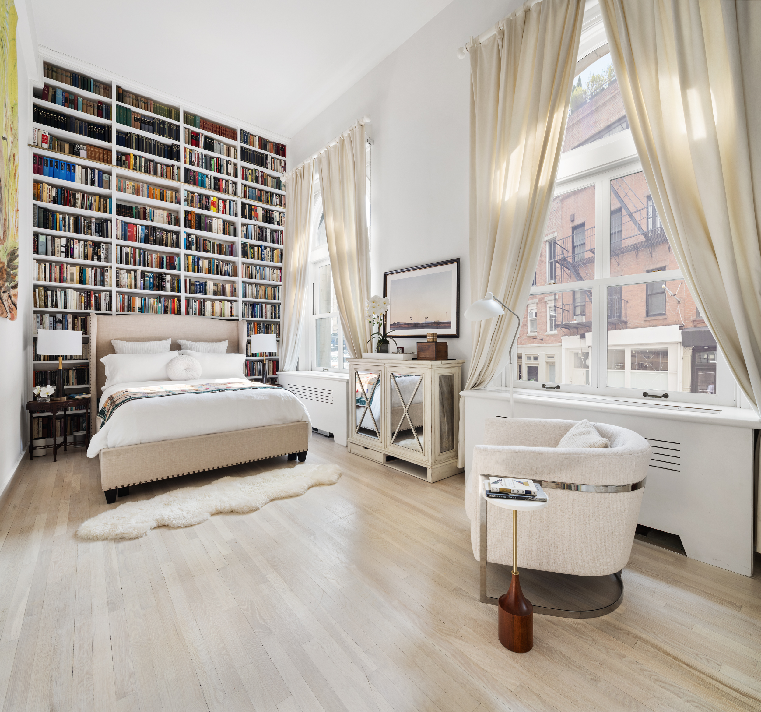 240 Centre Street, Unit 2J Manhattan, NY 10013 - Photo 8 of 18 a bedroom with furniture and a large window