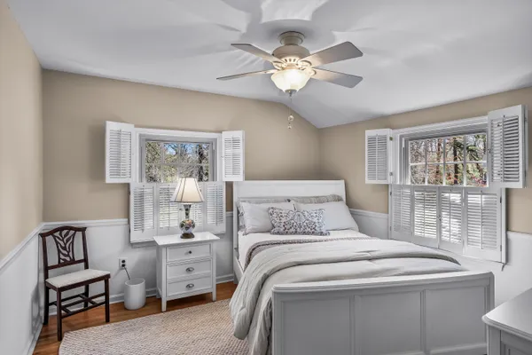 a bathroom with a sink mirror and tub