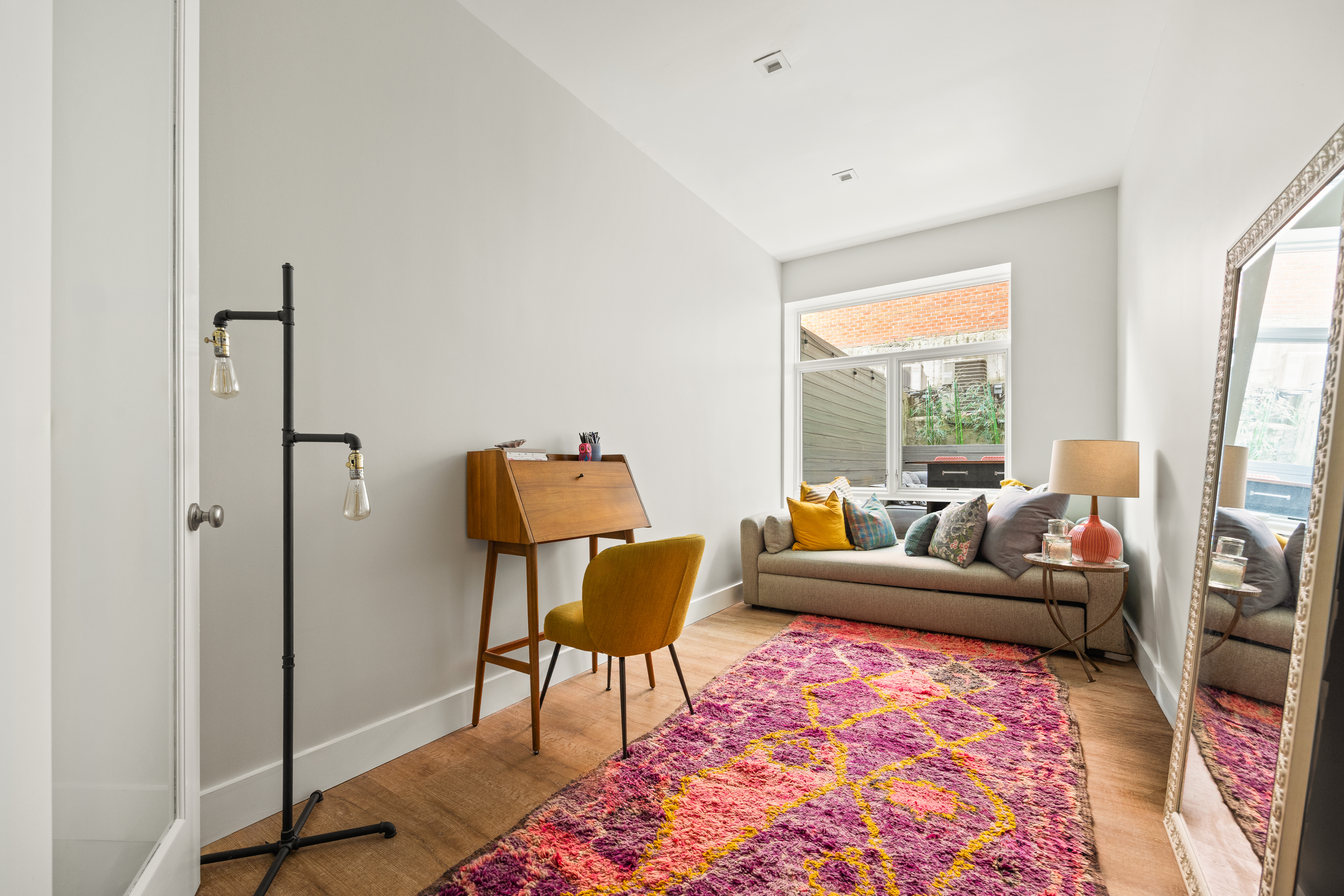 622 Grand Avenue, Unit 103 Brooklyn, NY 11238 - Photo 12 of 19 a living room with furniture and a rug