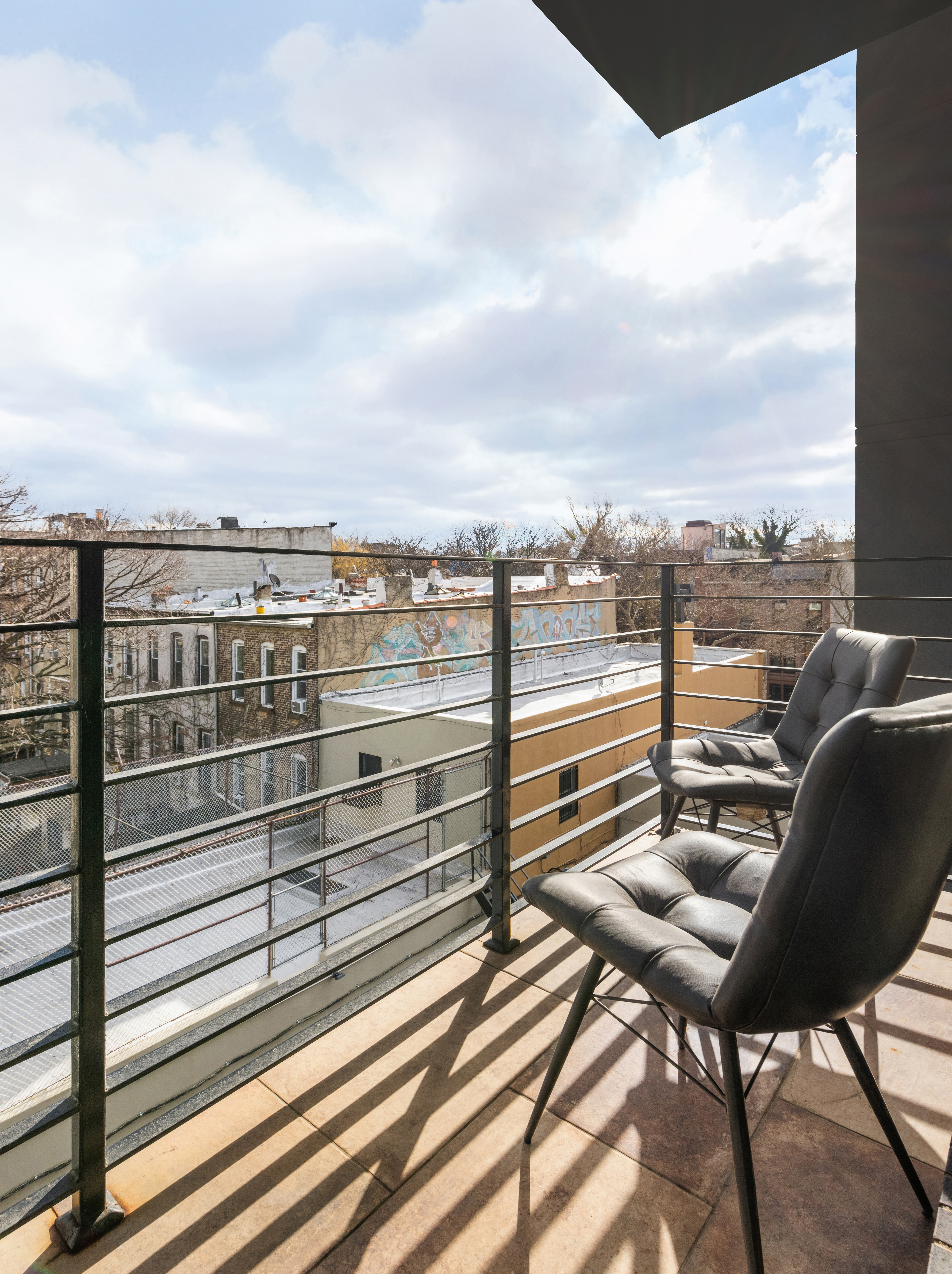 1021 Bedford Avenue, Unit 403 Brooklyn, NY 11205 - Photo 4 of 13 a view of a chairs and table on the terrace