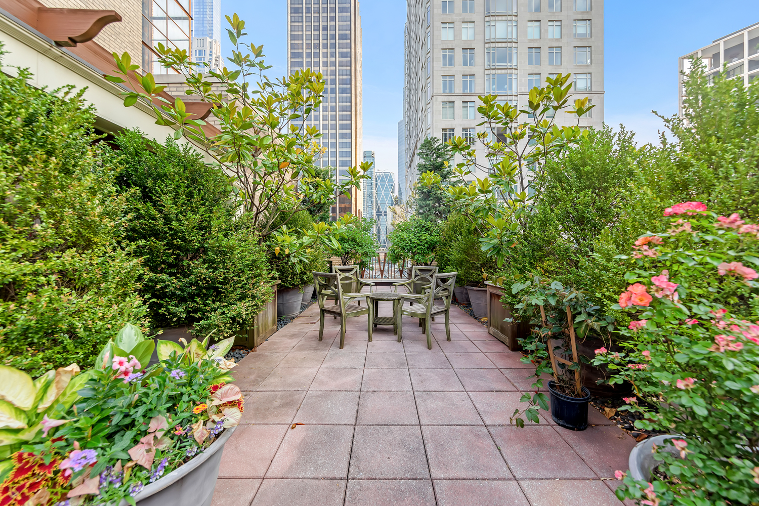 25 Central Park West, Unit 21J Manhattan, NY 10023 - Photo 6 of 37 a view of a patio with table and chairs and potted plants